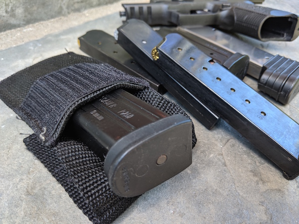 magazine pouch, extra mags, and handgun