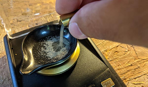 measuring the powder for 9mm reload