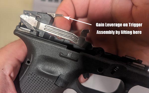 take apart Glock by lifting trigger assembly out